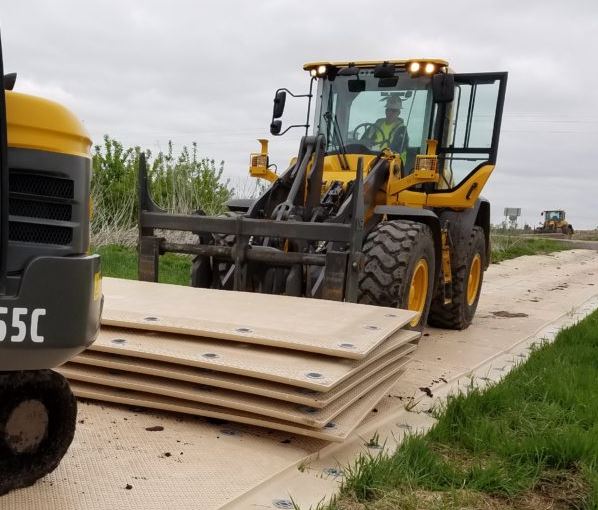 MegaDeck heavy duty HDPE mats being used in oil and gas industry operations showing durability and performance
